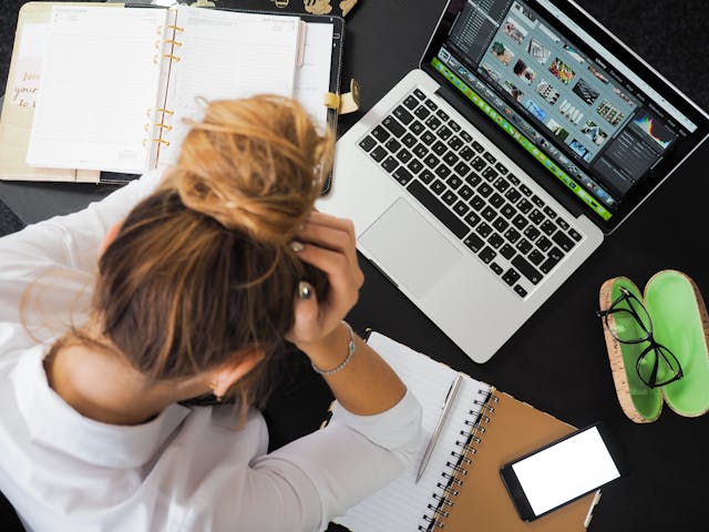 Person manually posting on social media, illustrating time-consuming manual posting process